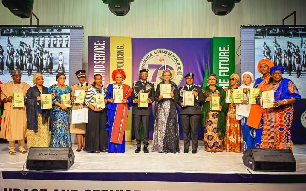 First Lady Senator Oluremi Tinubu, CON, poses with award recipients and senior police officers during the Nigeria Women Police @ 70 celebration.