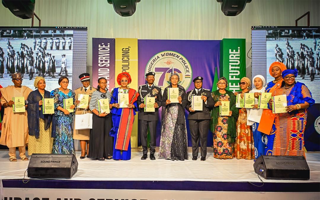 First Lady Senator Oluremi Tinubu, CON, poses with award recipients and senior police officers during the Nigeria Women Police @ 70 celebration.