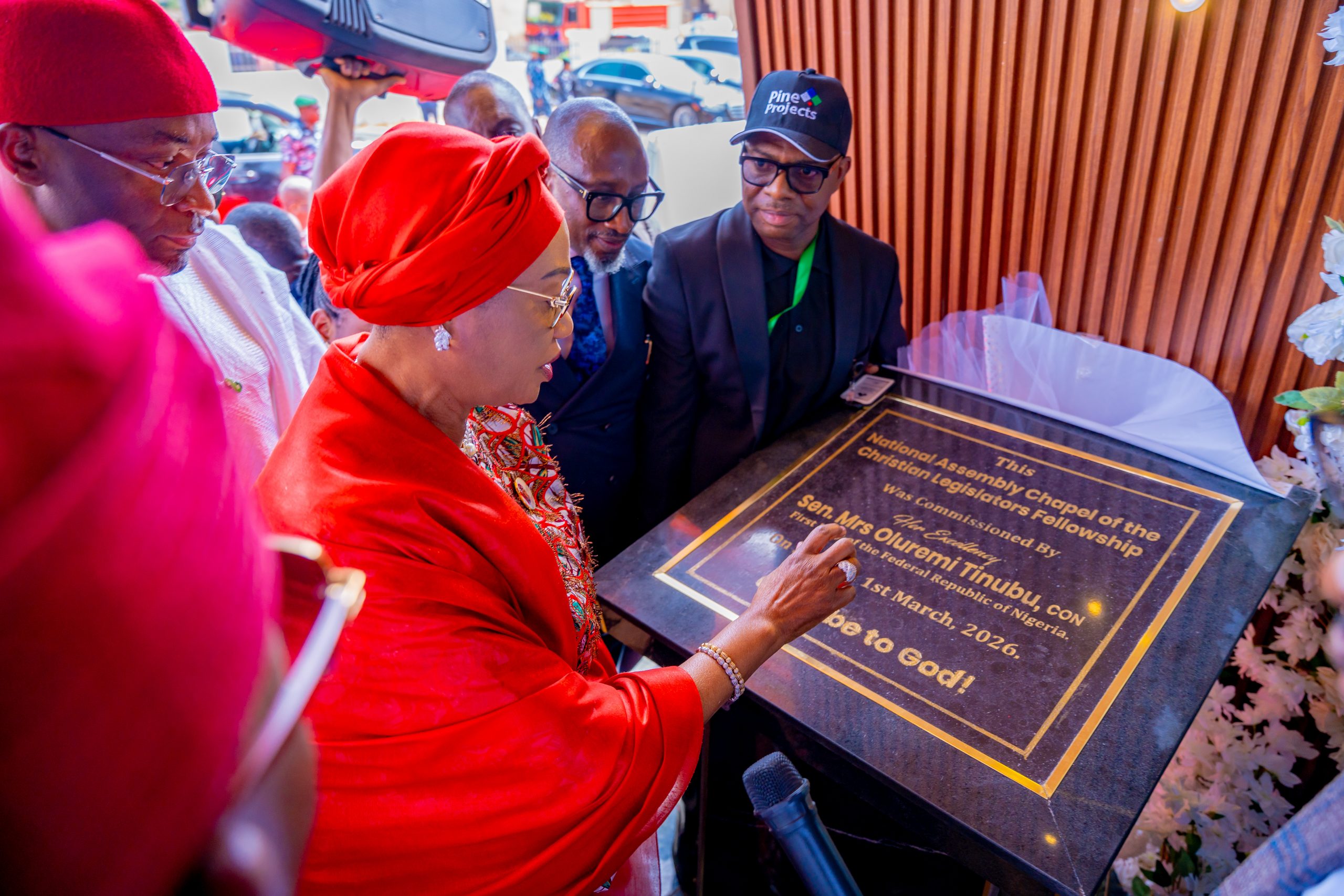 First Lady Senator Oluremi Tinubu, CON, unveiling a commemorative plaque to commission the National Assembly Chapel of the Christian Legislators Fellowship.