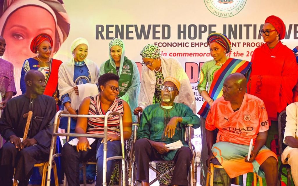 First Lady Senator Oluremi Tinubu, CON, engages with beneficiaries, including persons with disabilities and senior citizens, during the Renewed Hope Initiative Economic Empowerment Programme.